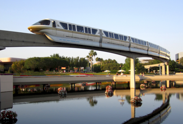 Train crossing bridge above water